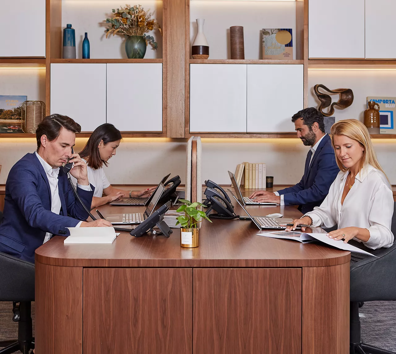 The team of a Junot agency gathered around a desk