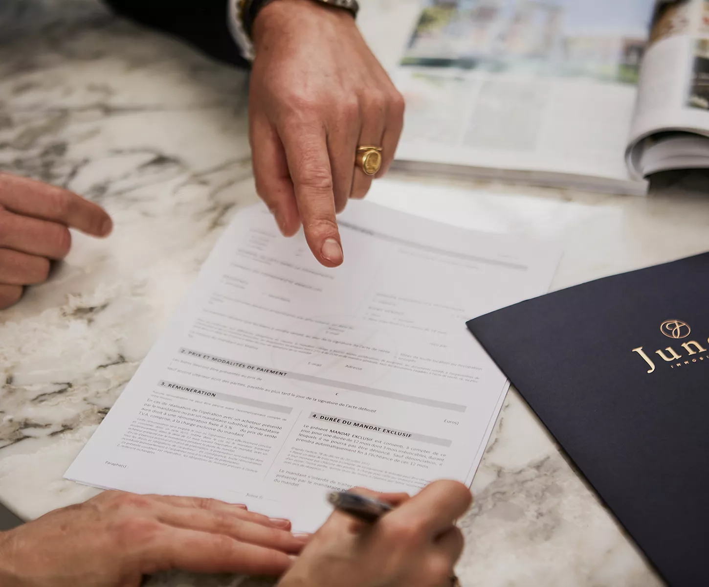 People signing a Junot agency agreement