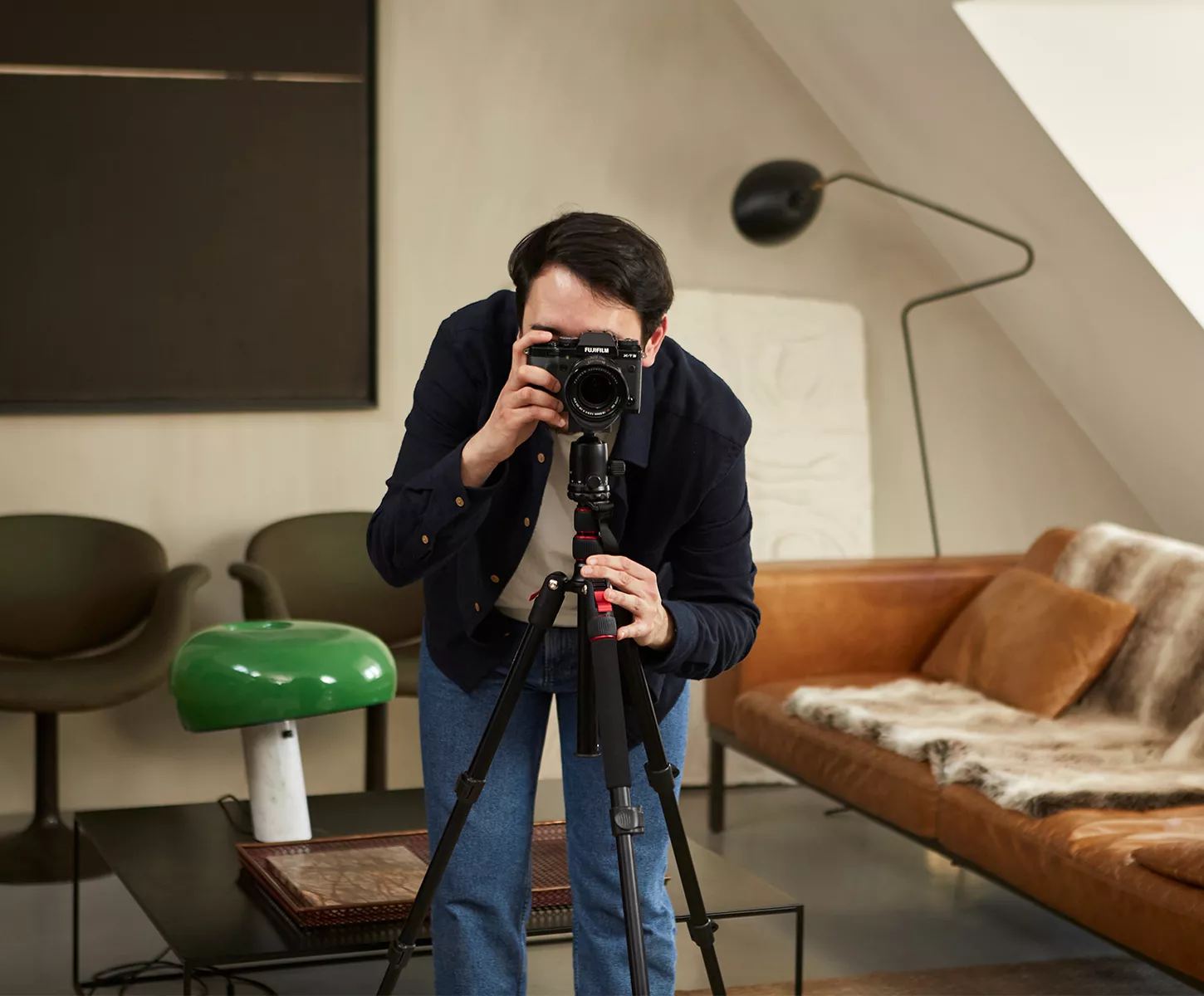 A professional photographer in a luxury apartment