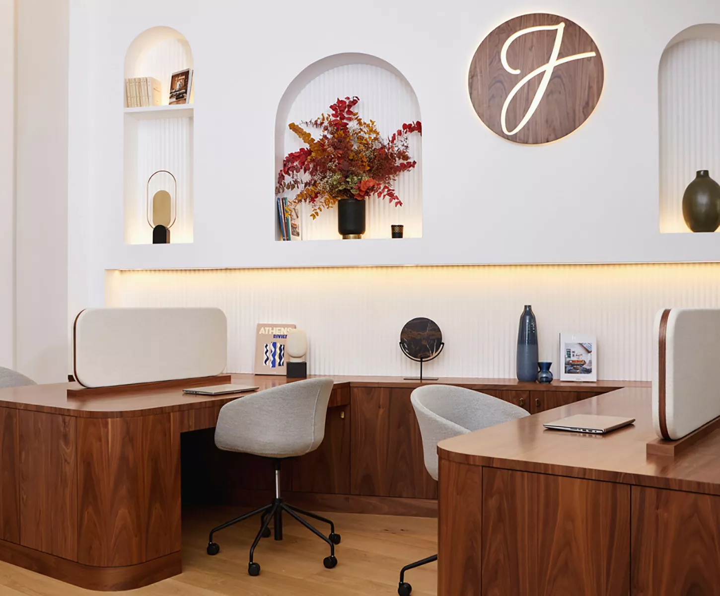 Interior of a Junot estate agency with dark wooden desks