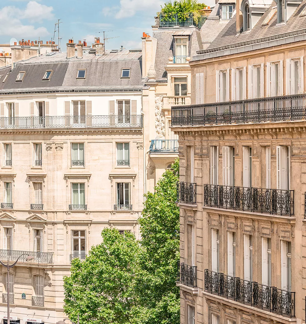 Façade of a luxury Haussmannian building located in Paris