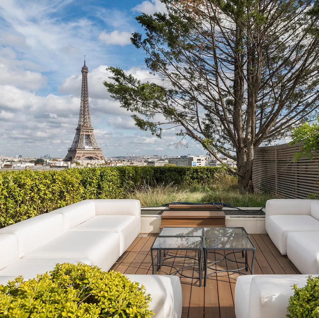 Terrace of a luxury top floor apartment with a view of the Eiffel Tower in Paris